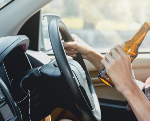 young-tourists-are-driving-while-drinking-alcohol_38663-230